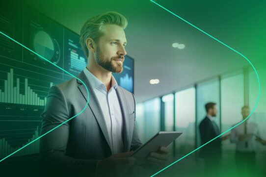 Homem em terno usando tablet em ambiente corporativo