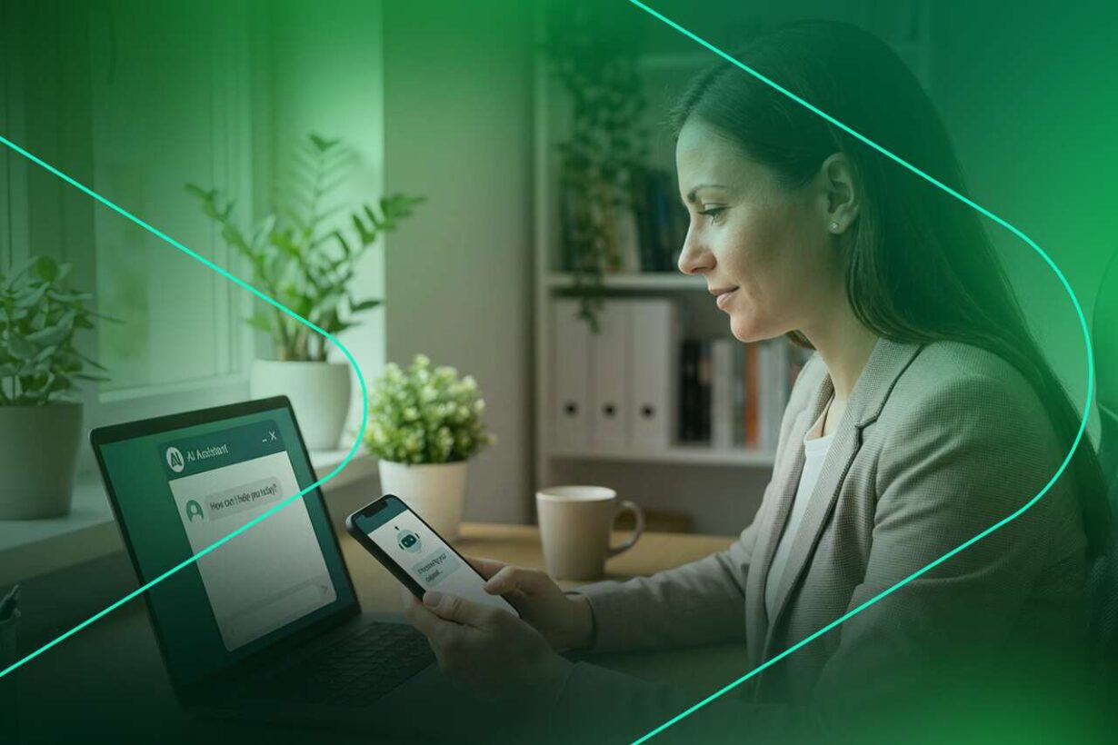 Mulher usando smartphone e laptop em ambiente moderno.