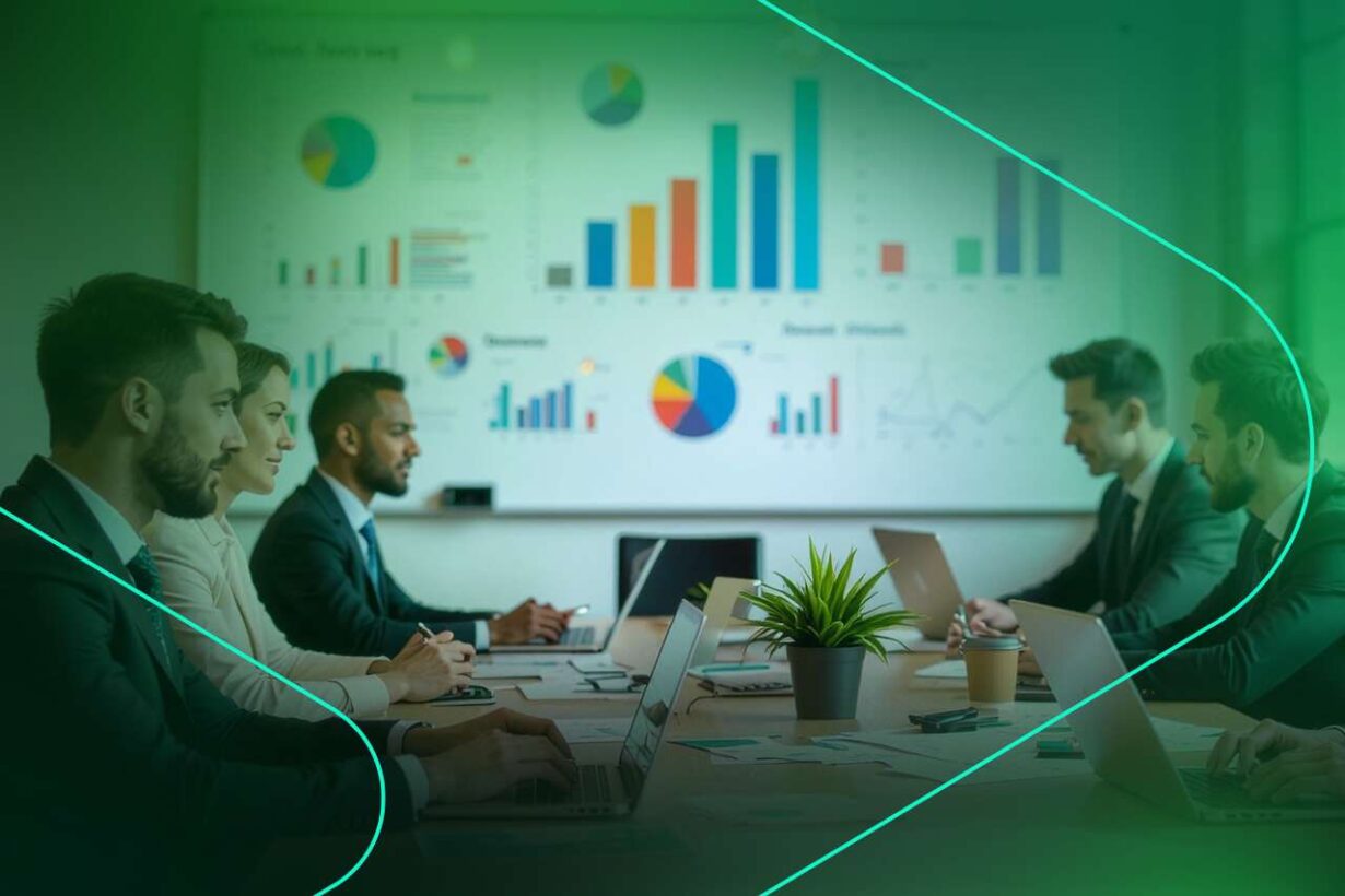 Reunião empresarial com gráficos e laptops