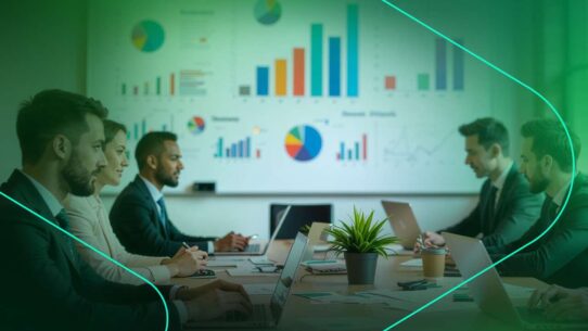 Reunião empresarial com gráficos e laptops