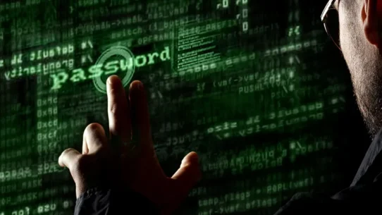 Homem interagindo com uma tela holográfica, semelhante à um terminal de computadores.