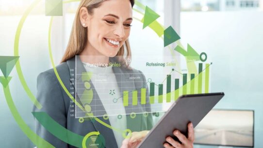 Mulher analisando gráficos de vendas em tablet.